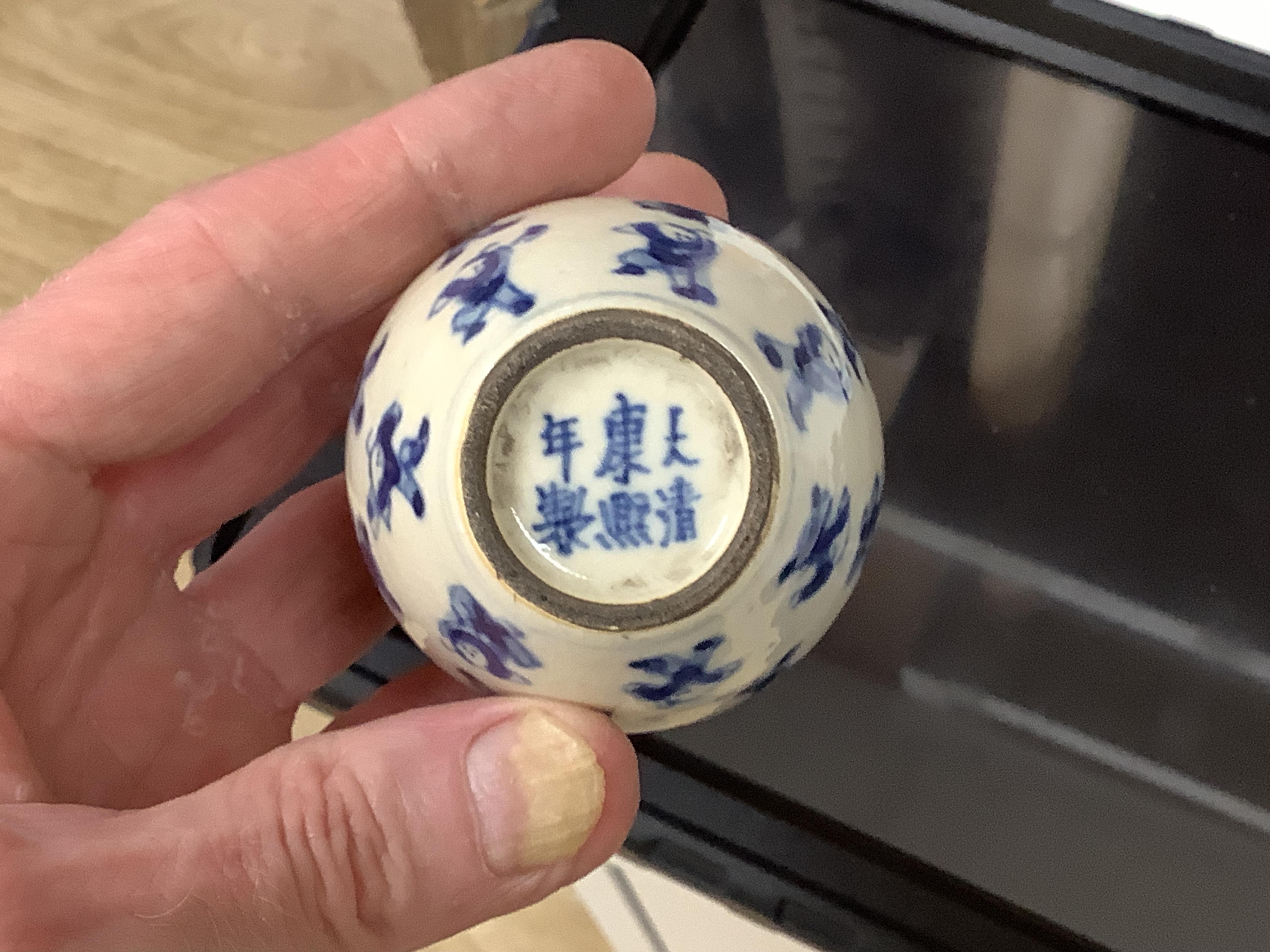 A pair of late 19th/early 20th century Chinese famille verte lion dogs and a similar pair of blue and white miniature ‘boys’ jars and covers, 15cm